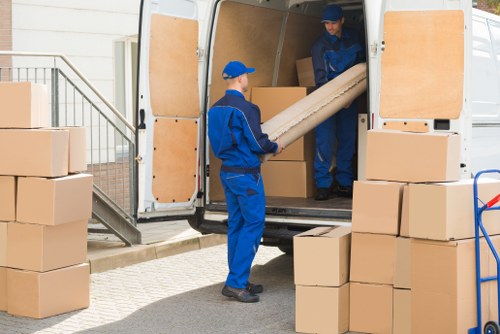 Student removals team helping with boxes and furniture in West Kensington