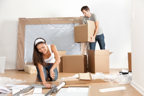 Furniture removals team loading household items in West Kensington