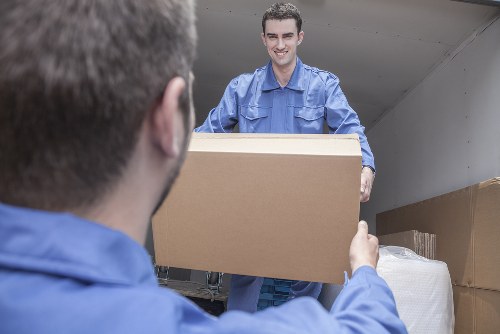 Careful handling of a grand piano during a local West Kensington relocation