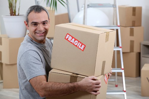 Removal service preparing items for a shared student flat move in West Kensington