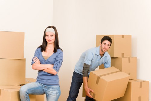Furniture and boxes being loaded for a house move in West Kensington