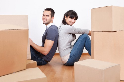 Staff carefully handling and securing household items during a move