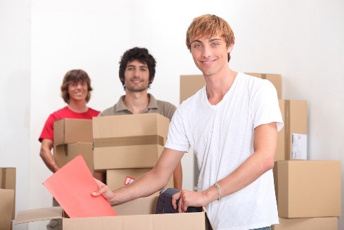 Removal van and packed items representing free quote service in West Kensington